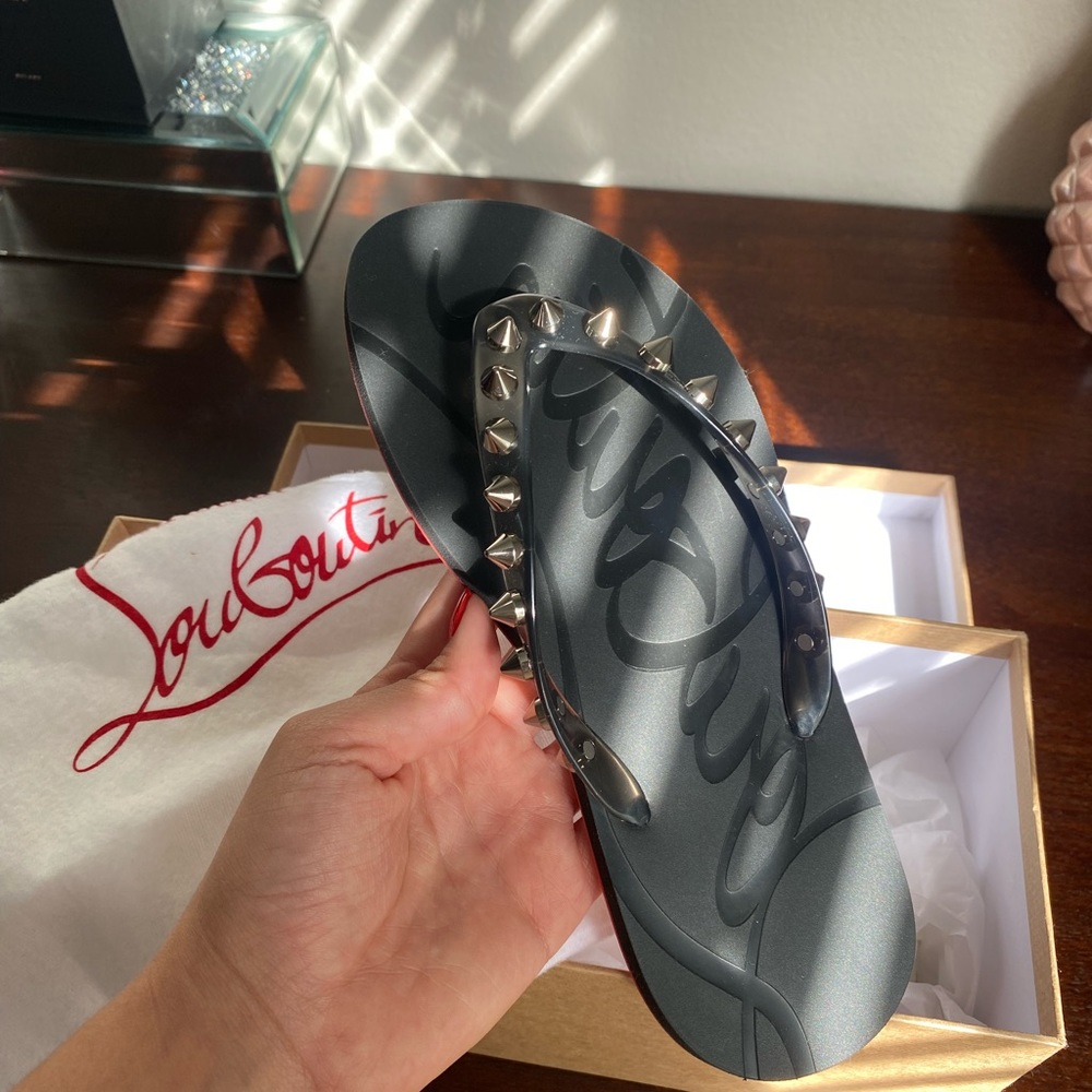 Christian Louboutin flip flops never worn